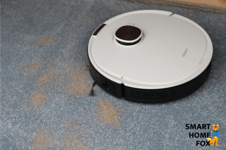 Ecovacs Deebot OZMO T8+ during the sand suction test on a high carpet